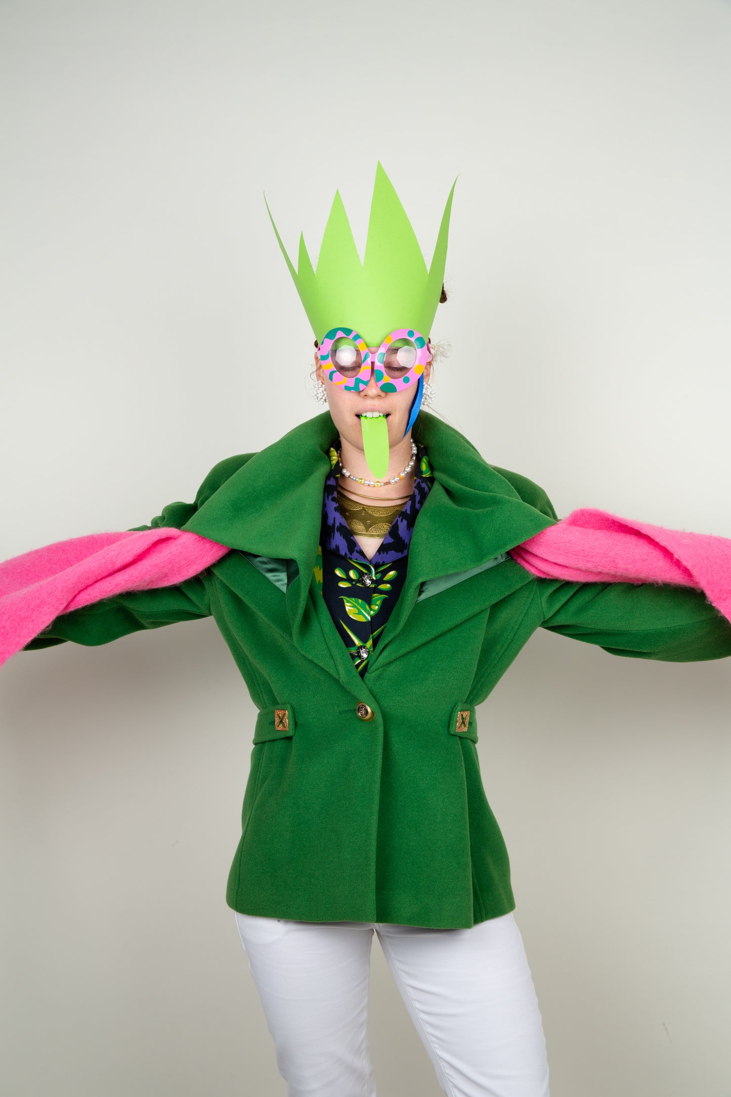 The Scarf-holder coat in moss green with gold details