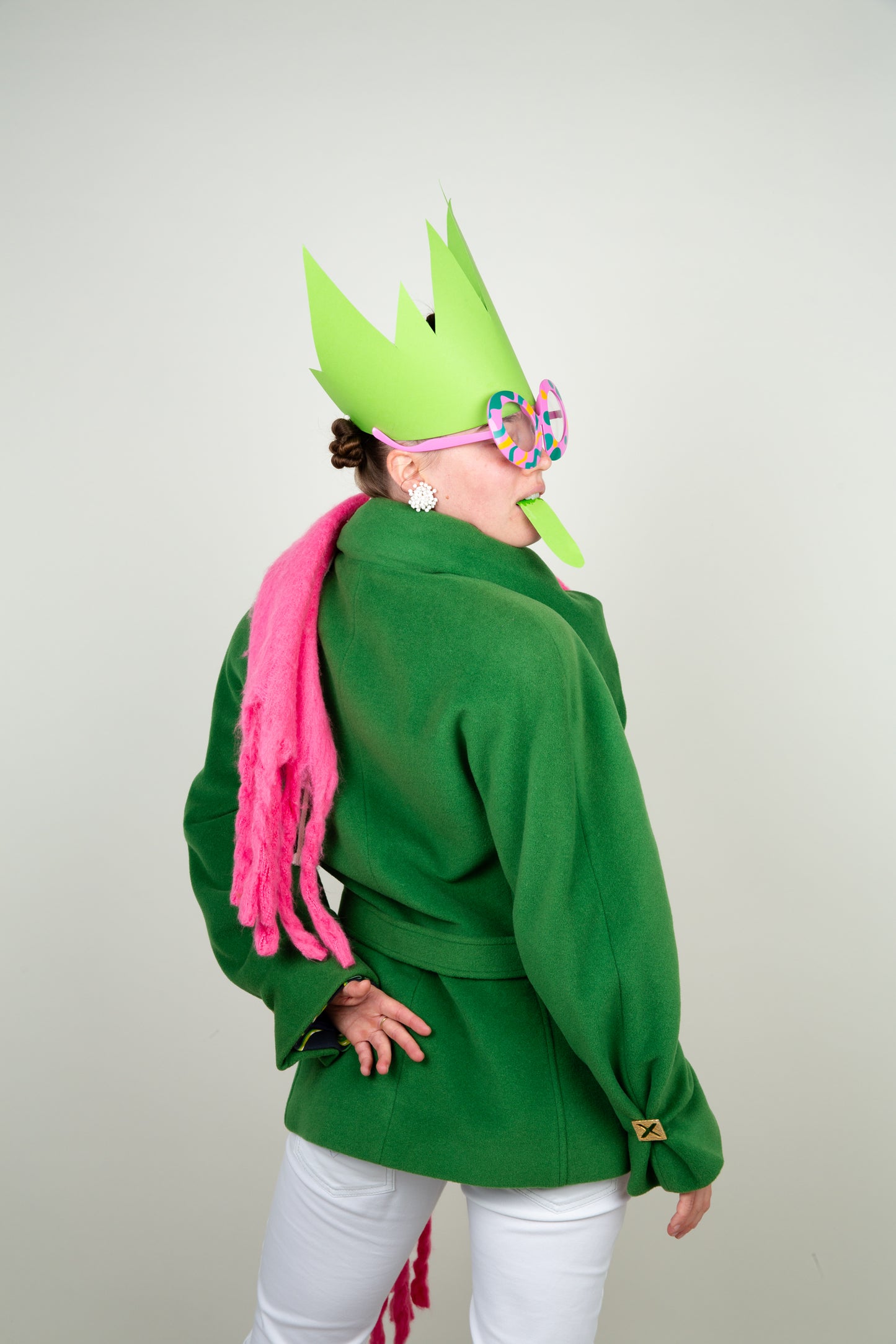 The Scarf-holder coat in moss green with gold details