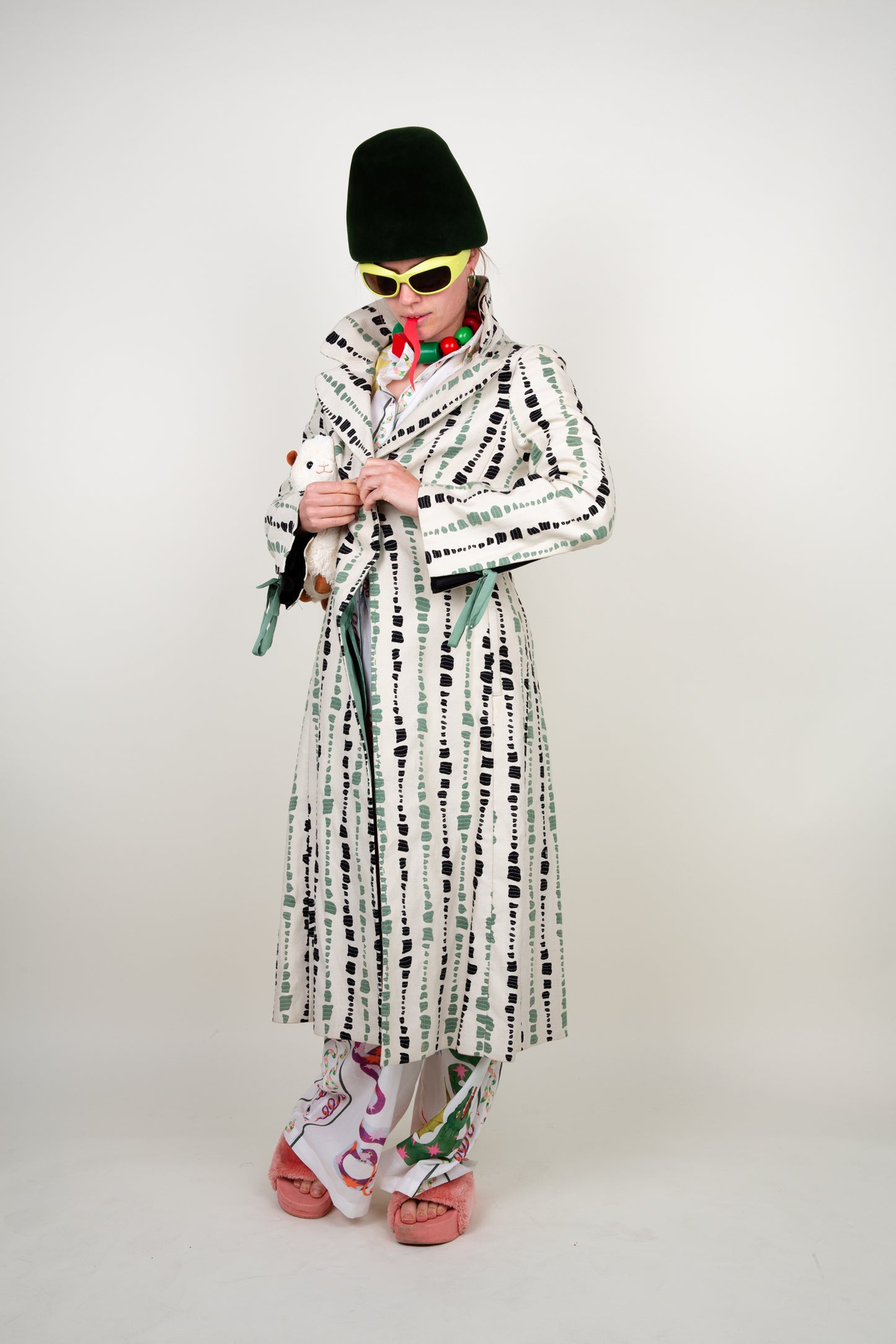 The artist coat in white, green and black