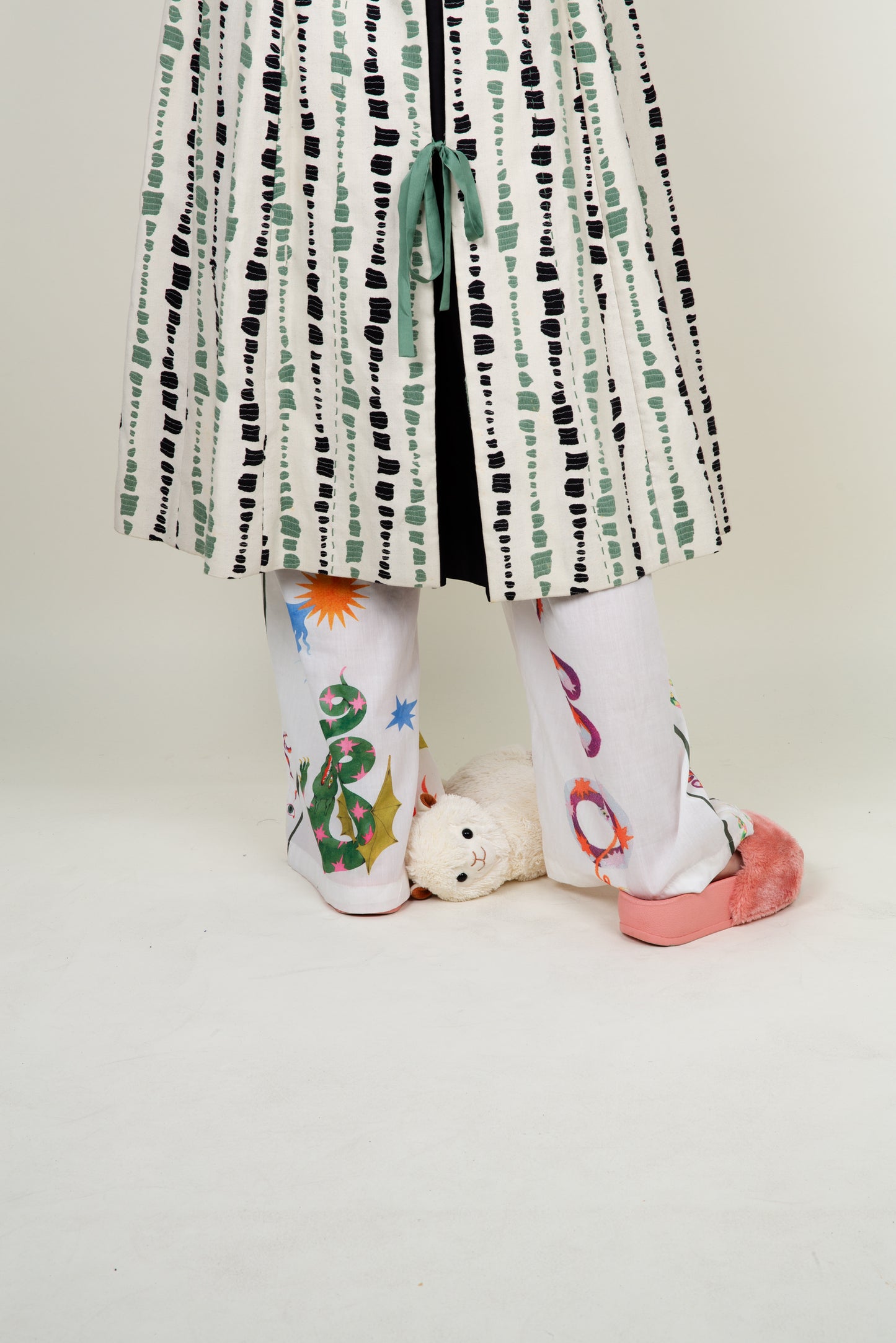 The artist coat in white, green and black