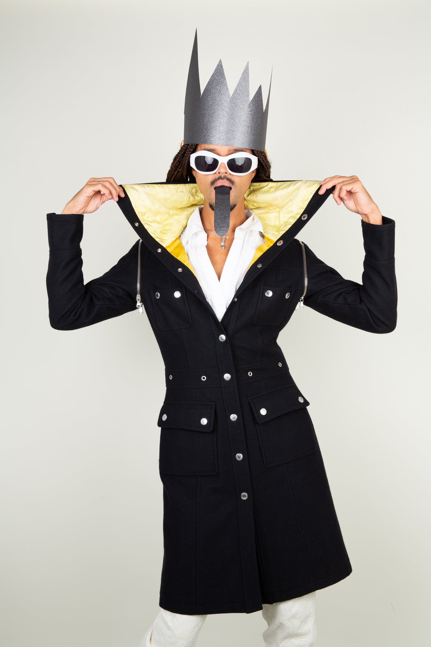 The Dolce & Gabbana black yellow collar coat with adjustable sleeves and silver details