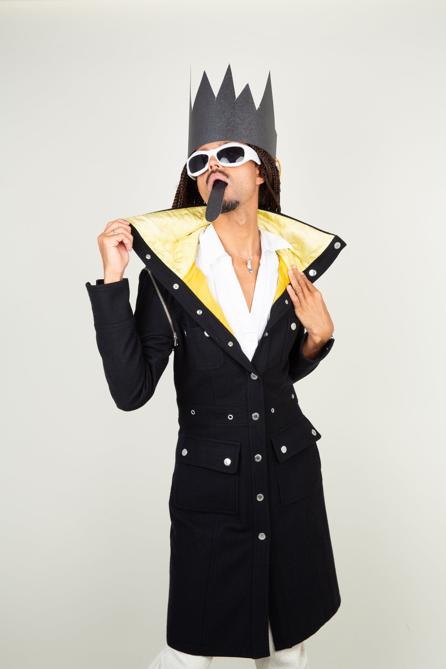 The Dolce & Gabbana black yellow collar coat with adjustable sleeves and silver details