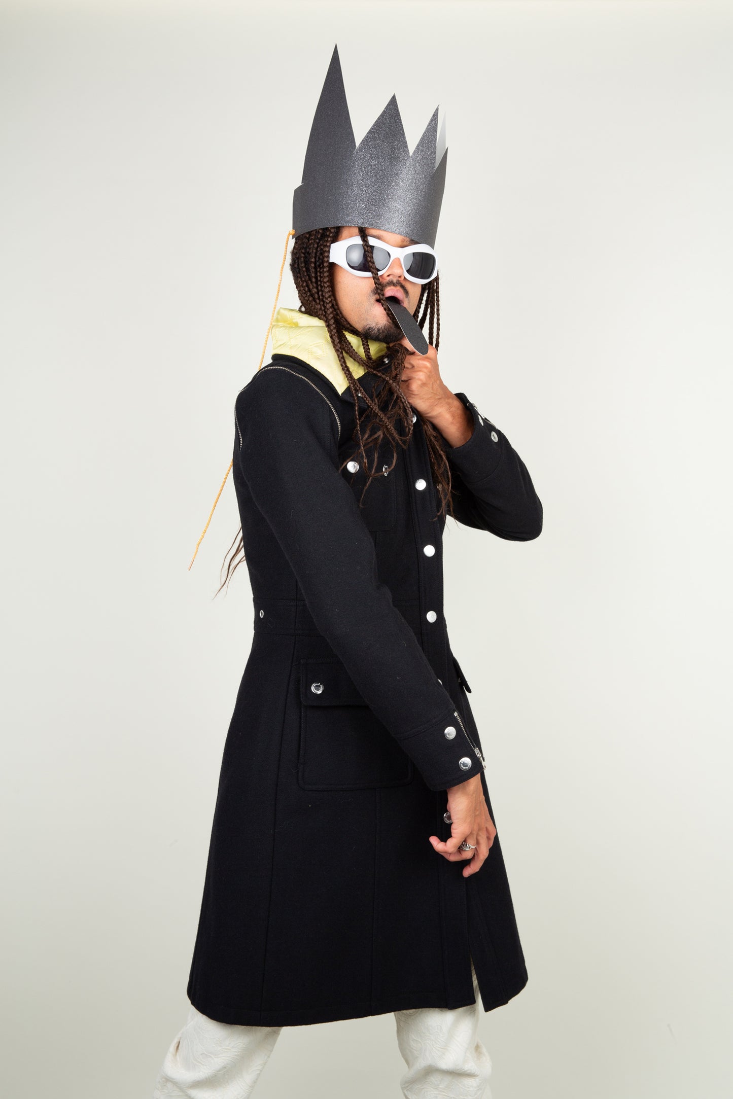 The Dolce & Gabbana black yellow collar coat with adjustable sleeves and silver details