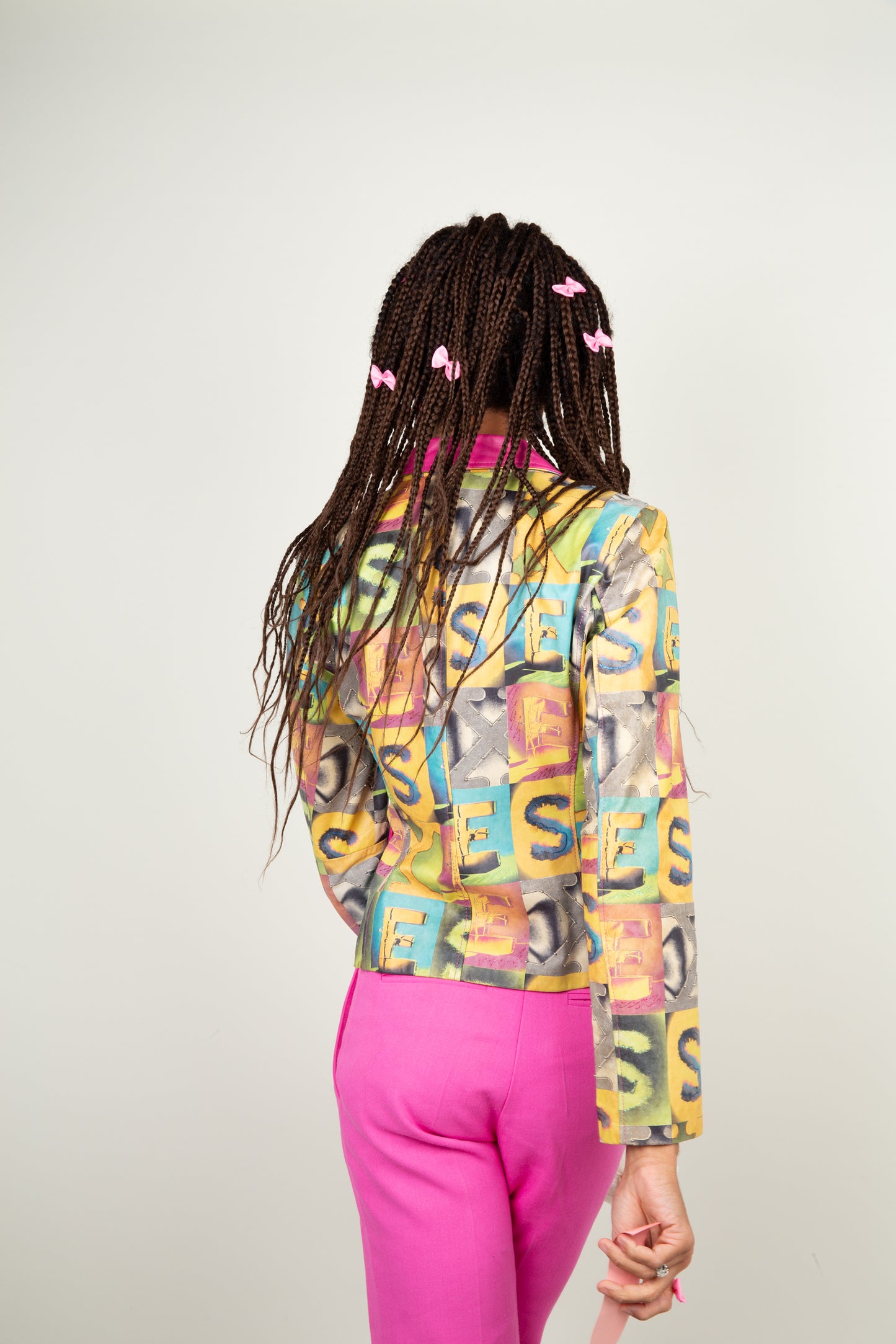 The retro S-E-X print jacket in multicolors and hint of pink fuchsia