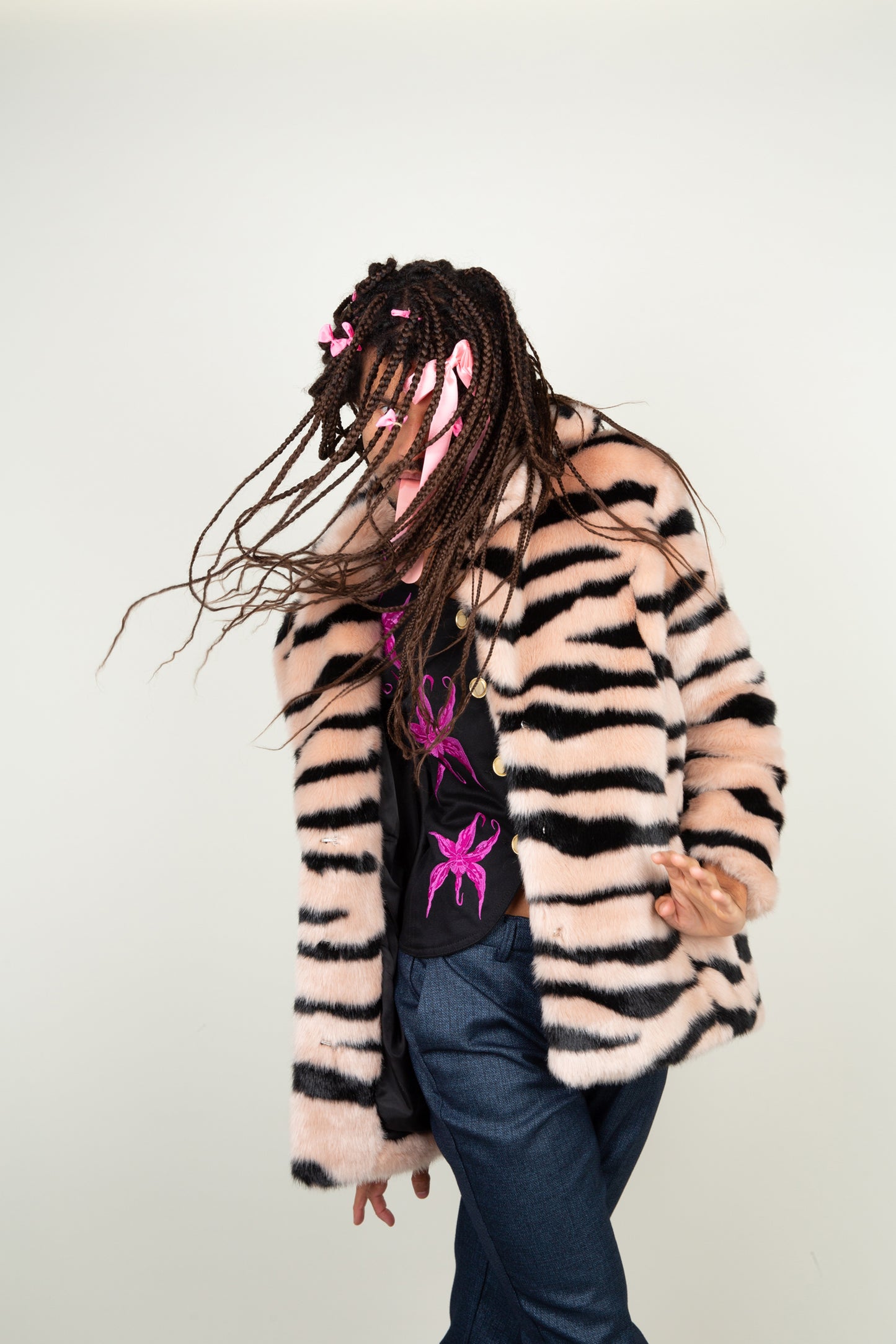 The Faux Tiger Striped coat in black and light pink tints