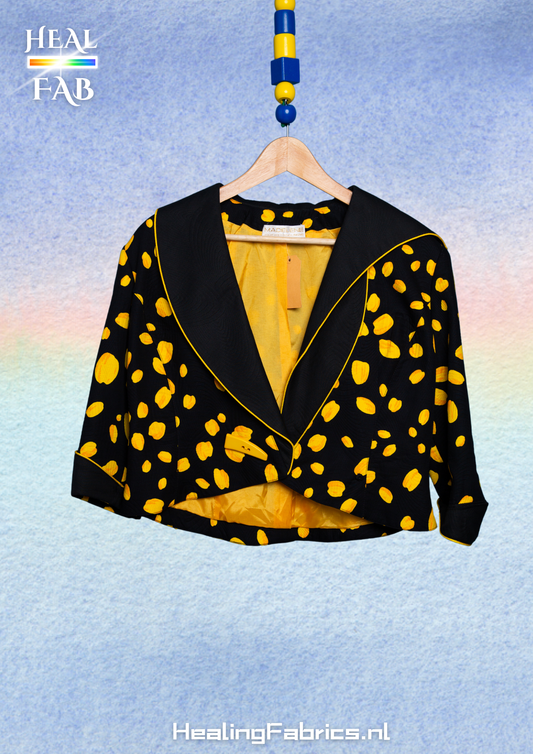 The reversed polka-cheese blazer with asymmetrical collar in black & yellow tint