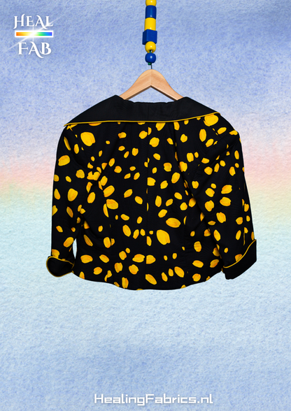 The reversed polka-cheese blazer with asymmetrical collar in black & yellow tint