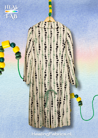 The artist coat in white, green and black