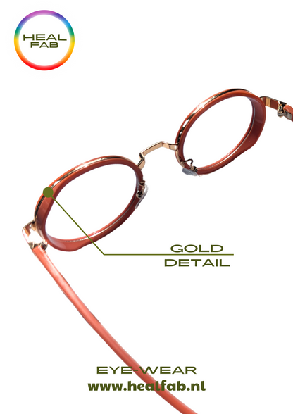 The Coral Classic sunglasses with oval shaped blue vision & gold details