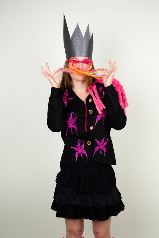 The black flower blazer with vibrant rasberry pink floral embroidery